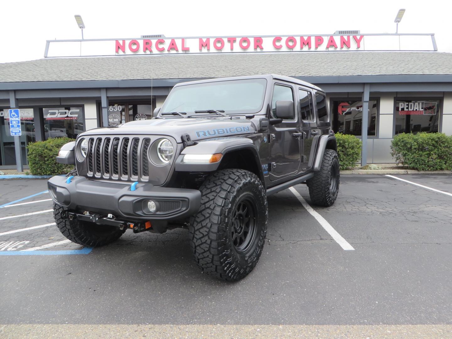 2021 CHARCOAL /BLACK Jeep Wrangler Unlimited Rubicon 4XE 4d SUV 4wd (1C4JJXR60MW) with an 2.0L L4 DOHC 16V TURBO engine, automatic transmission, located at 2630 Grass Valley Highway, Auburn, CA, 95603, (530) 508-5100, 38.937893, -121.095482 - 4XE Rubicon sitting on a Zone offroad suspension system, Fox shocks, 37" Toyo RT trail tires, 17" Method Race wheels, Teraflex Hd tire carrier, and Flat tow ready. - Photo#0